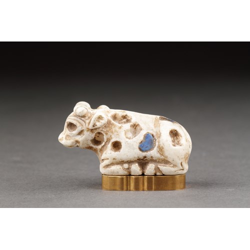 Ancient Near Eastern Sumerian Uruk White Limestone Votive Statuette of a Reclining Young Bull Inlaid with Lapis Lazuli
